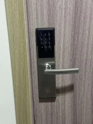 a door with a metal handle on a wooden door at Entire 1 BR condo unit with balcony at MOA complex in Manila