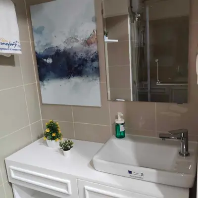 a bathroom with a sink and a mirror at Homefort Twin Bed Suite - Red Residences Unit 2649 in Manila