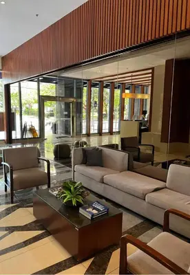 a living room with two couches and a coffee table at Newly Renovated 2-storey Loft at Greenbelt 1 Near Legaspi Park in Manila