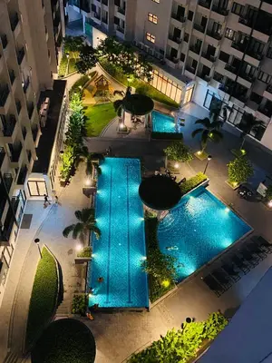 an overhead view of a pool in a building at 2 Bedroom with Massage Chair 15 minutes from NAIA in Manila