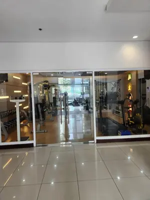 a gym with a view of a gym with machines at Staycation By JEM - Across NAIA T3 in Newport City in Manila