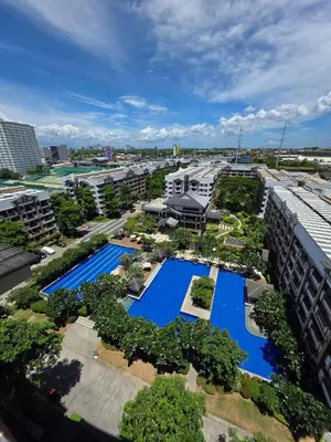 an aerial view of a building with pools and trees at The Yanoa Stay 2 Bedroom Condo in Manila