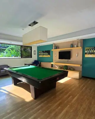 a living room with a pool table in it at The Yanoa Stay 2 Bedroom Condo in Manila