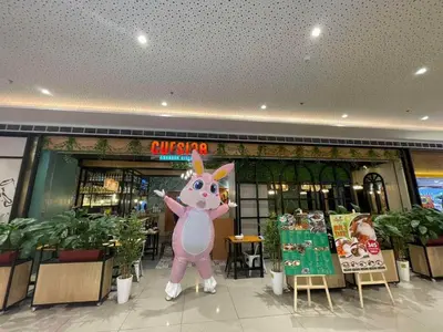 a large pink unicorn in front of a store at Air Residences- Netflix with City View in Manila