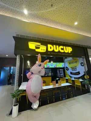 a giant pink pig in front of a dinosaur restaurant at Air Residences- Netflix with City View in Manila