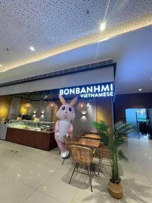 a restaurant with a mascot in front of a table at Air Residences- Netflix with City View in Manila