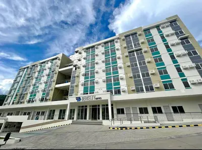 a large building with a lot of windows at Berkeley Breeze Staycation in Silang