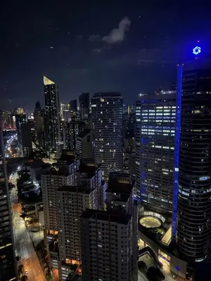 a view of a large city at night at Fully-furnished 1-br unit in Manila