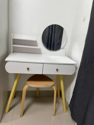 a white dressing table with a mirror and a stool at The Ren Suite Facing Amenities in Manila
