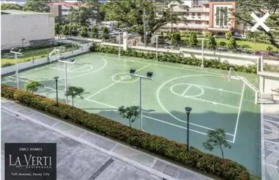an image of a tennis court in a city at LaVerti 1BR Affordable staycation groups family in Manila