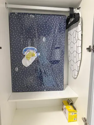 a shower curtain in a drawer in a bathroom at Bayhaus MNL - Pet-friendly Condo near MOA in Manila