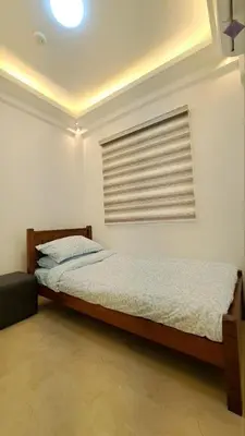 a bedroom with a bed and a window at Brand New Home! 3BR, 5 Beds, 3 Baths, Full AC in San Agustin