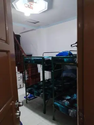 a room with a room with a bunk bed at male bedspace in Manila