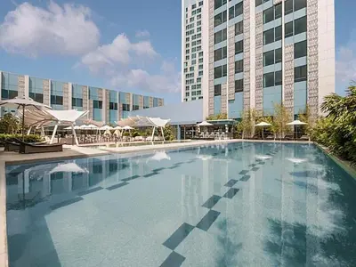a large swimming pool in front of a building at BBricks Alabang Beside Festival Mall in Manila