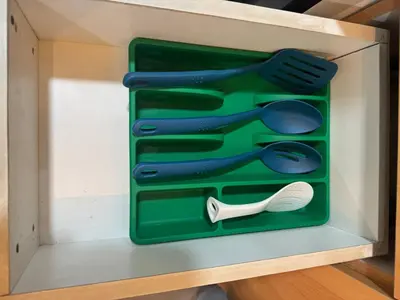 a green box with utensils in it at Modern Spacious 2BR 68 sqm Condo in Manhattan Heights Pool View in Manila