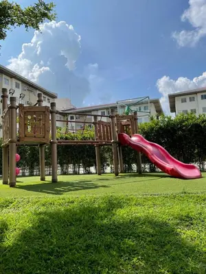 a playground with a slide in a park at Nuvali - Free use of Massage Chair-Pool Access-Hot Shower in Calamba