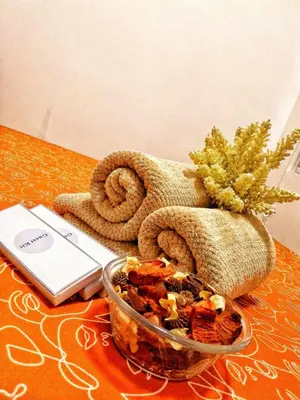 a table with a bowl of food and a towel at DS Staycation in Manila