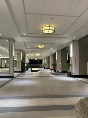 an empty lobby with a large room with plants at Modern 2BR Condo with Balcony in Central Manila in Manila
