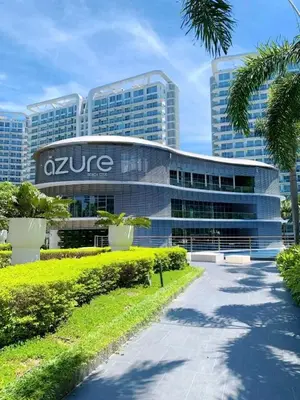 a building with a sign on the front of it at 1BR Unit Azure Urban Resort Residences in Manila