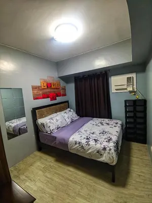 a bedroom with a bed in a room at 1Bedroom for rent Amaia Skies Shaw in Manila