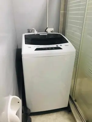 a white sink in a bathroom next to a toilet at 1Bedroom for rent Amaia Skies Shaw in Manila