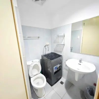 a bathroom with a toilet and a sink at Sea Residences Yanah Staycation in Manila