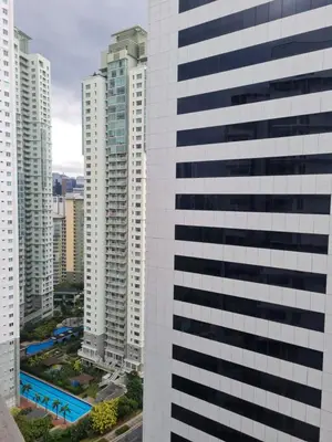 a view of a tall building in a city at Superior Studio Urban Escapes at BCCT in Manila