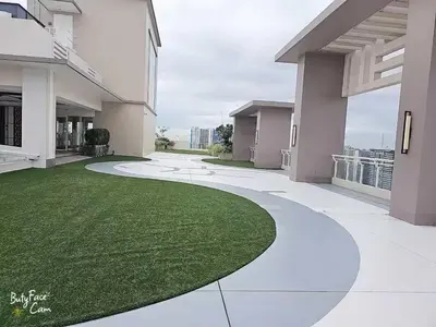 a walkway in a house with a green lawn at V-TAN condo in Manila