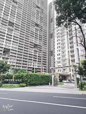 a city street with tall buildings in the background at V-TAN condo in Manila