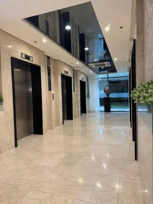 a lobby of a building with a hallway with doors at Metro Prime Stays at Shore 2 Residences in Manila