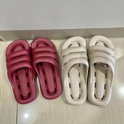 four pairs of shoes are lined up on a shelf at Teychi's Staycation at Shore2 MOA Pasay in Manila