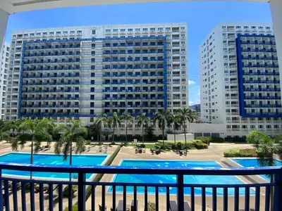 a view from the balcony of a hotel with two buildings at Sea Residences Santorini Vibes - Reynil in Manila