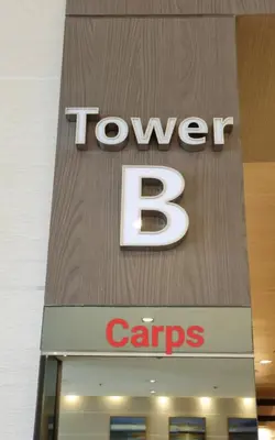 a sign for a tovyben caraves store at Carps Staycation in Manila