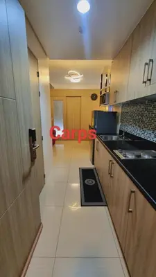 a view of a kitchen with a door and a room at Carps Staycation in Manila