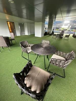 a room with chairs and a table and a table and chairs at Mall of Asia shore 3 Tower 21661 Residence in Manila