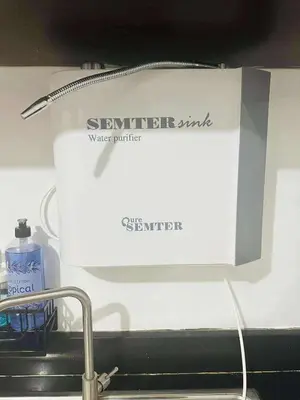 a box with a bottle of detergent next to a sink at Cozy Studio in Paraaque - Perfect for Transients and Long-Stayers Alike in Manila