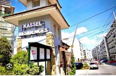a building with a sign on the side of it at Cozy Studio in Paraaque - Perfect for Transients and Long-Stayers Alike in Manila