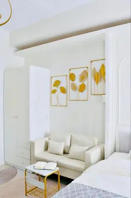 a living room with a couch and a table at Bai Labi Luxury Lounge in Manila