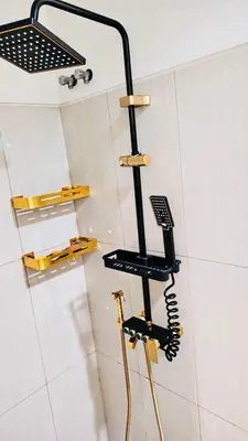 a shower with a hair dryer in a bathroom at Bai Labi Luxury Lounge in Manila