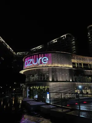 a building with a sign on it at night at B&T Azure Staycation - Parañaque in Manila