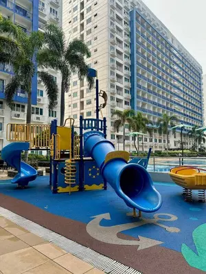 a playground with a slide in a park at The Tenth Balcony in Manila