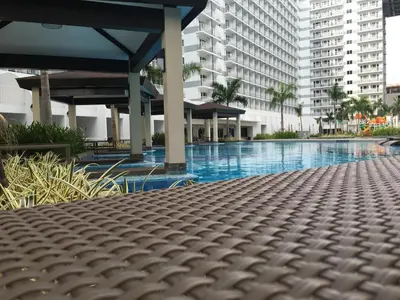 a large swimming pool with buildings in the background at 349B by Premiere Haven Shell Residences in Manila