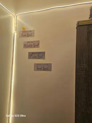 a wall with four signs on it with words on it at Staycation near MOA, SMX Convention, DFA & NAIA, in Manila
