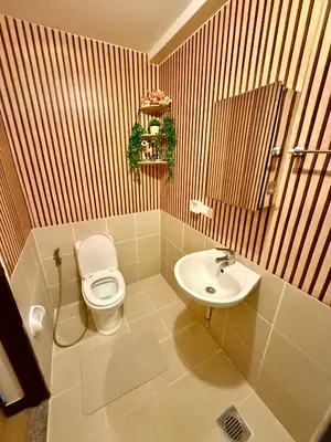 a bathroom with a toilet and a sink at YourSafeHaven in Manila