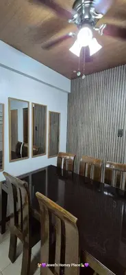 a conference room with a long table and chairs at JeweIs Homey Place -2br in a resort-like condo in Manila