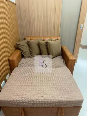 a bed in a room with a sign on it at EyaLove's Staycation in Manila