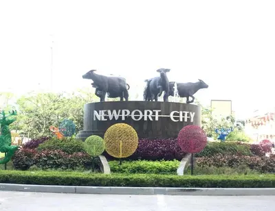 a newport city sign with statues of cows on it at RER-101 Newport Boulevard, Pasay City, Metro Manila, Philippines near NAIA Terminal 3 in Manila