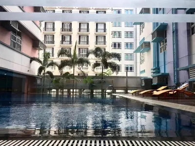 a building with a pool in front of a building at RER-101 Newport Boulevard, Pasay City, Metro Manila, Philippines near NAIA Terminal 3 in Manila