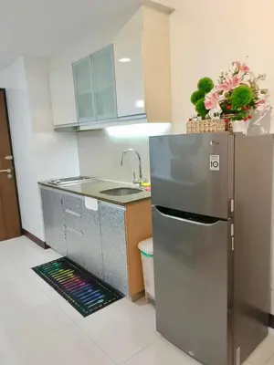 a kitchen with a stainless steel refrigerator and a sink at RER-101 Newport Boulevard, Pasay City, Metro Manila, Philippines near NAIA Terminal 3 in Manila