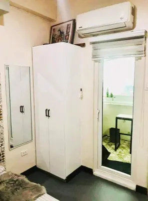 a room with a mirror and a white closet at Close by landmarks and airport in Manila